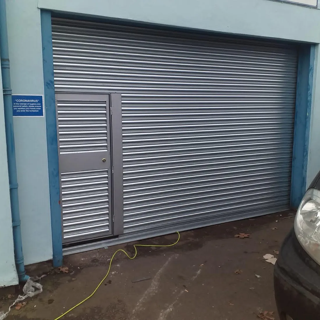 roller shutter with door